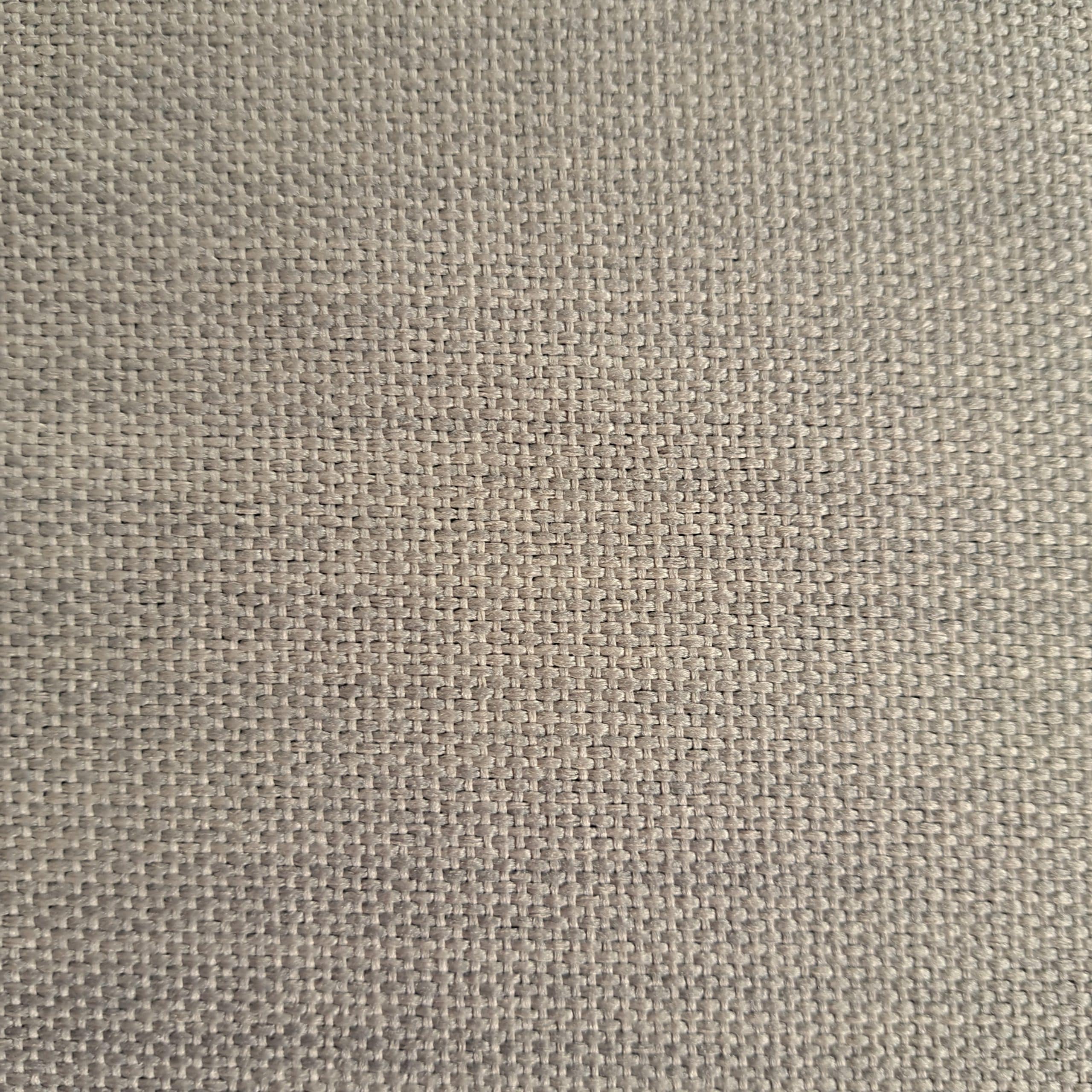 Close-up beżowego materiału z widoczną teksturą tkaniny.